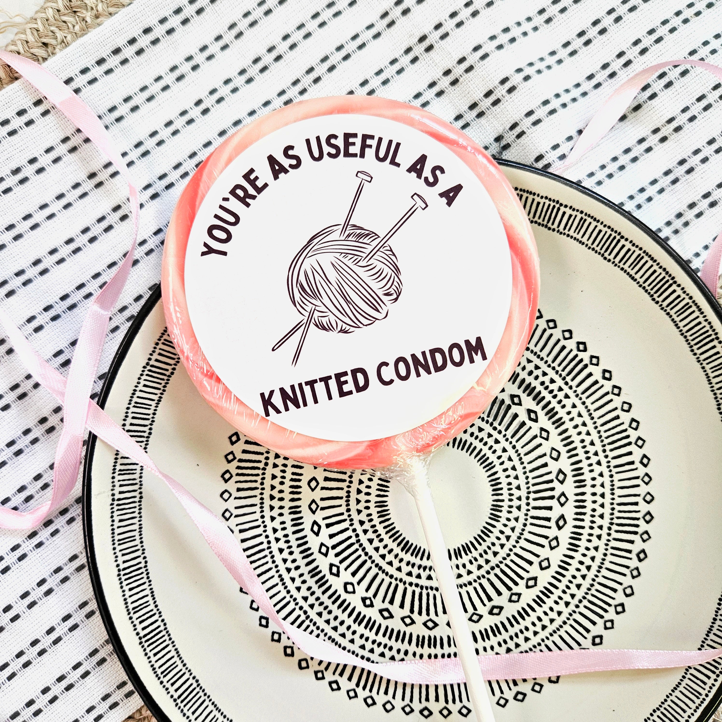 As Useful as a Knitted Condom Lollipop Suck It & Say